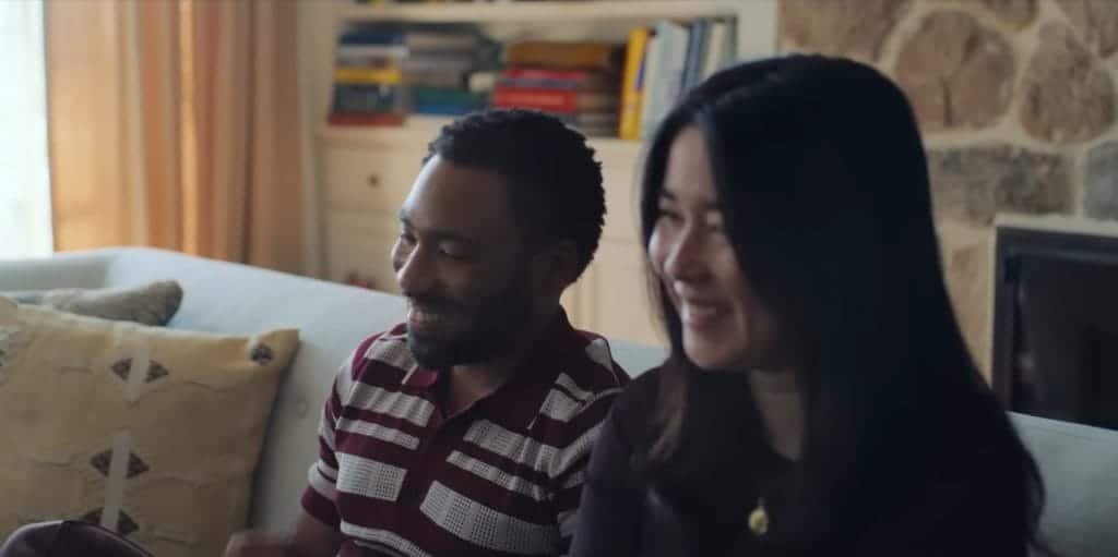 Glover and Esrkine sitting next to each other in a couples therapy session.